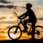 cyclist resting silhouette sunset active outdoor sport concept min 1024x683 1