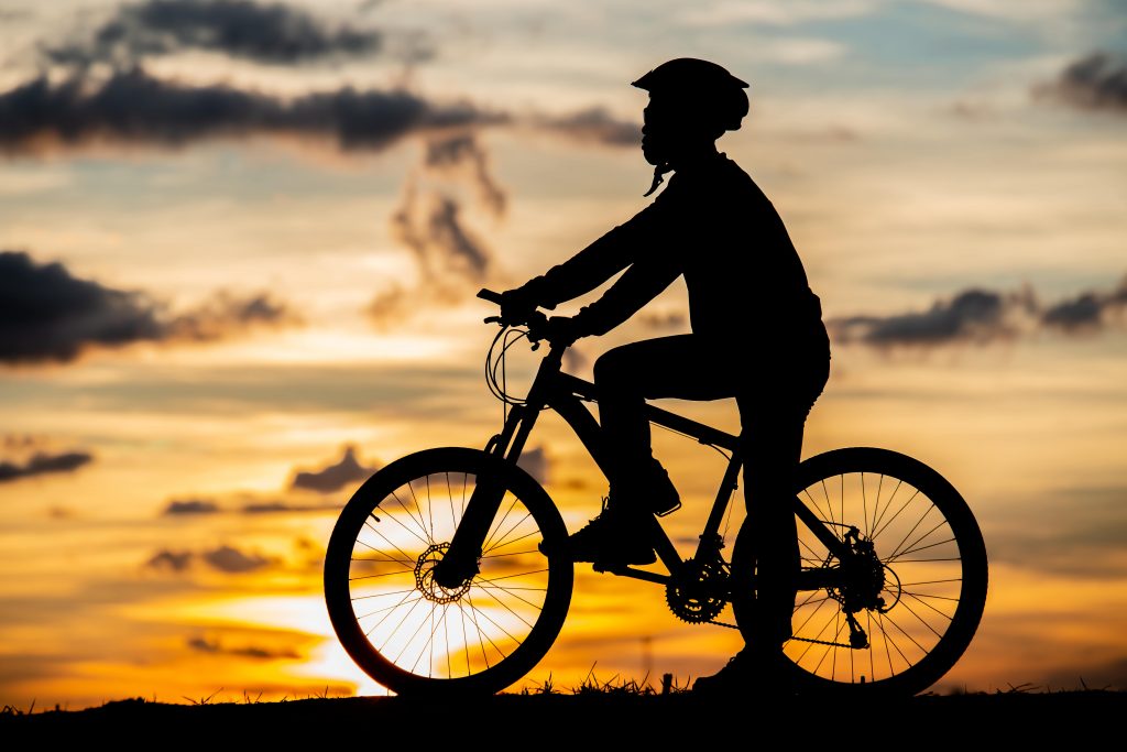 cyclist resting silhouette sunset active outdoor sport concept min 1024x683 1