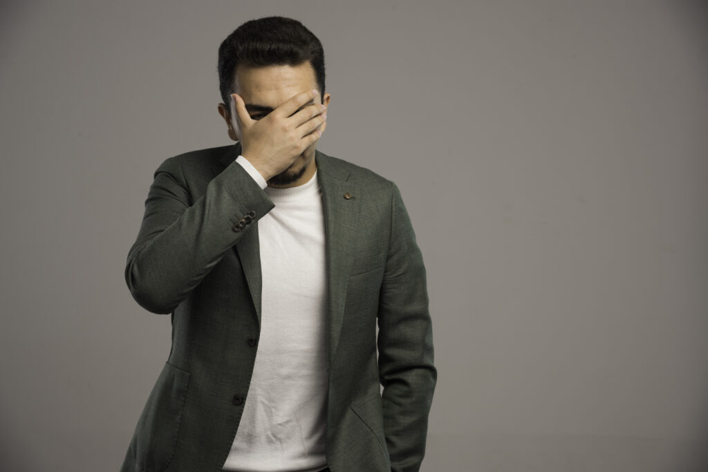 businessman dress code covering his face