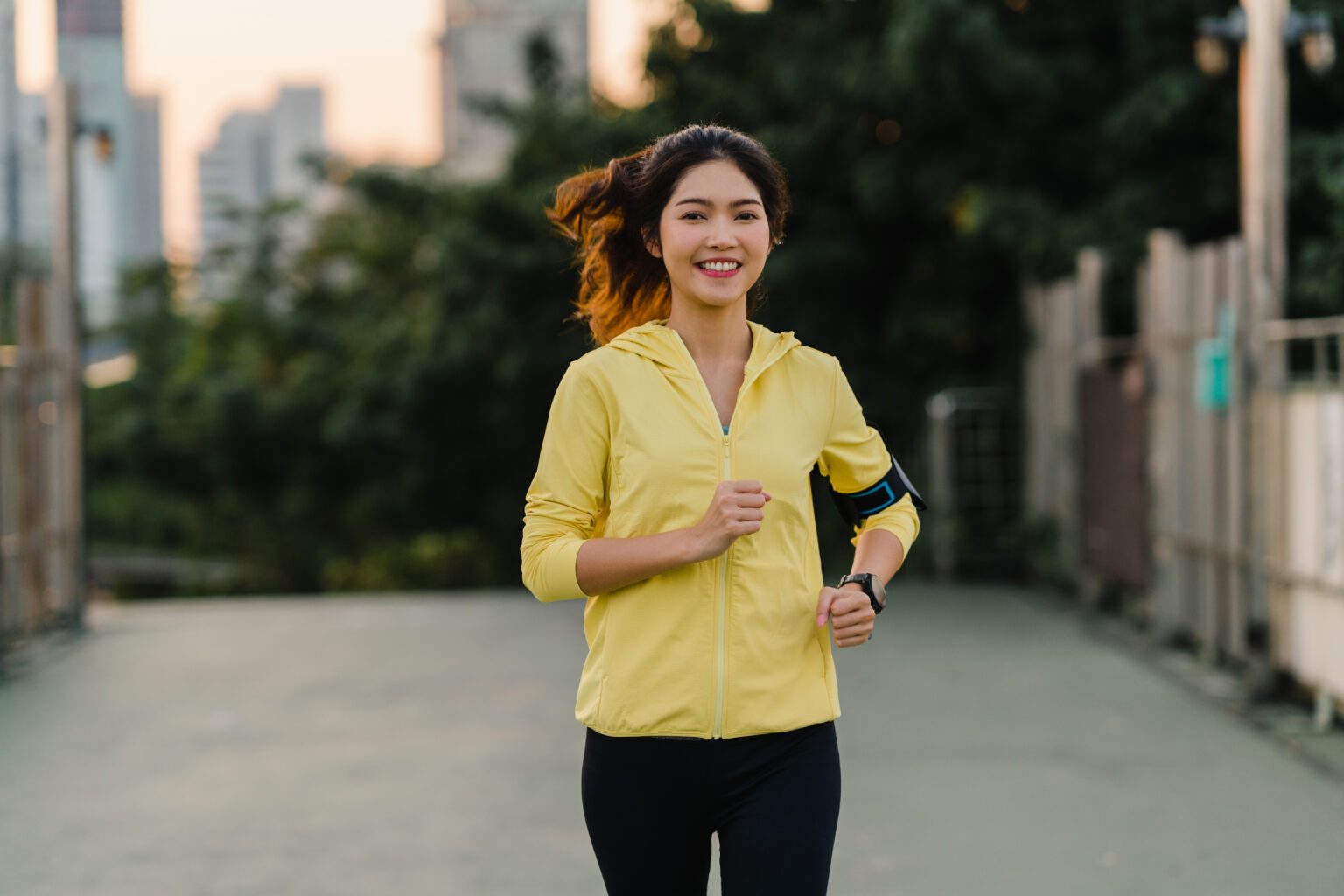 beautiful young asia athlete lady running exercises work out urban environment japanese teen girl wearing sports clothes walkway bridge early morning lifestyle active sporty city