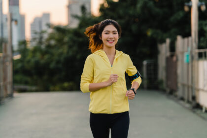 beautiful young asia athlete lady running exercises work out urban environment japanese teen girl wearing sports clothes walkway bridge early morning lifestyle active sporty city