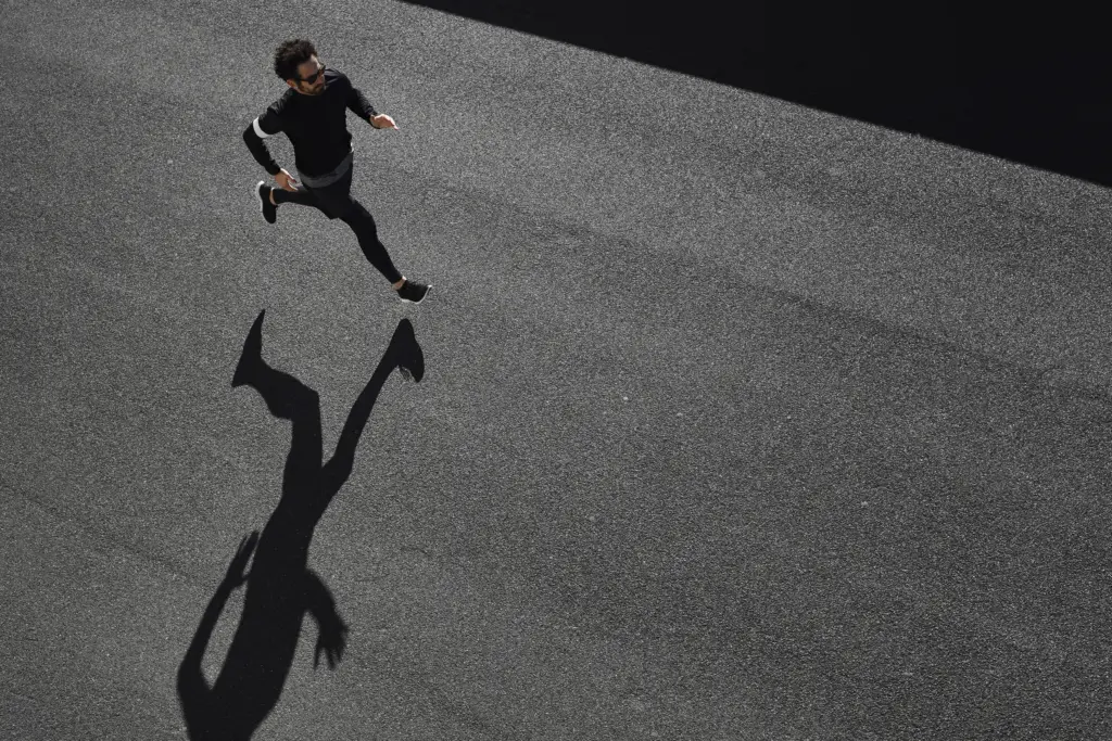 man sportswear running road