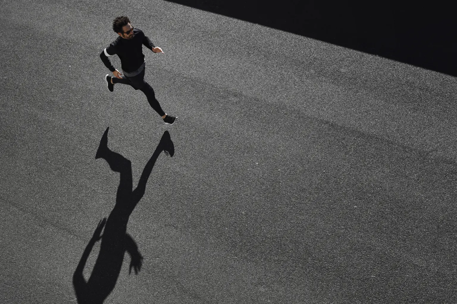 man sportswear running road